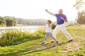 Grandfather and Grandson practicing Qigong